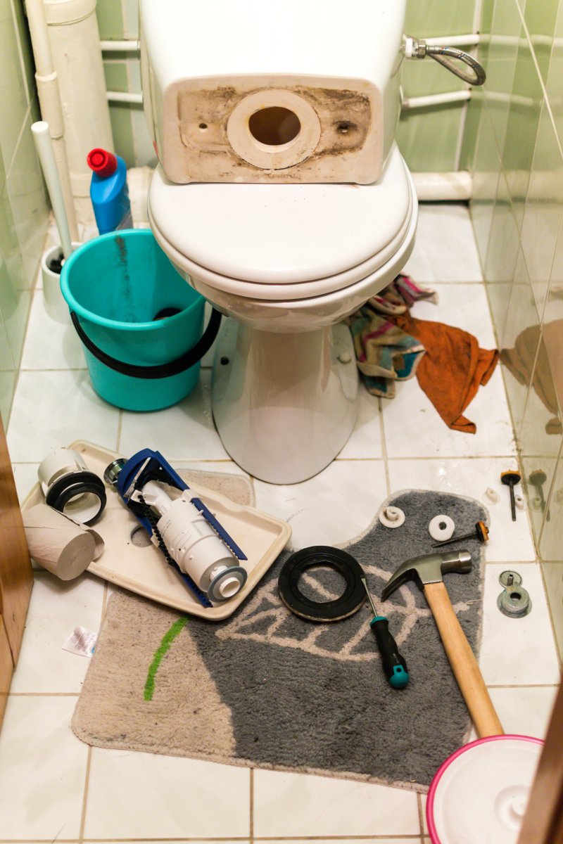 New toilet being installed in a Fulham bathroom