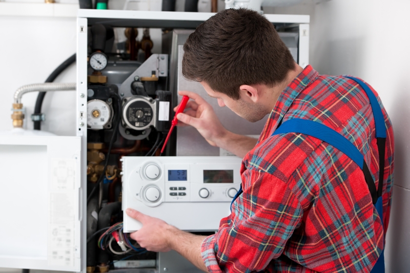 Gas Safe engineer working on a boiler in Fulham